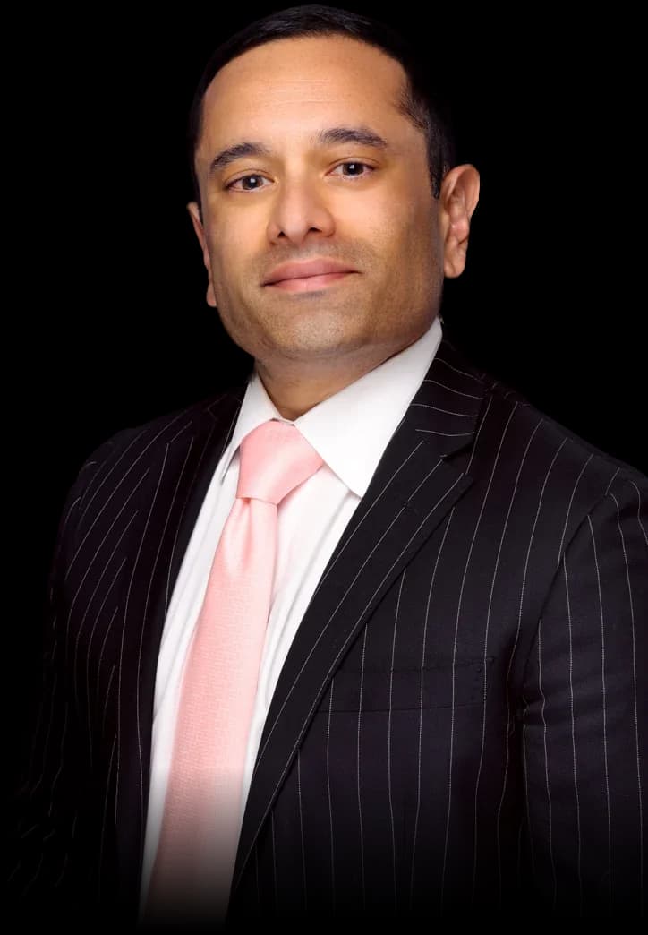 Nik Agharkar, founder of Crowne Point Tax & Wealth Counsel, in a pinstripe suit
